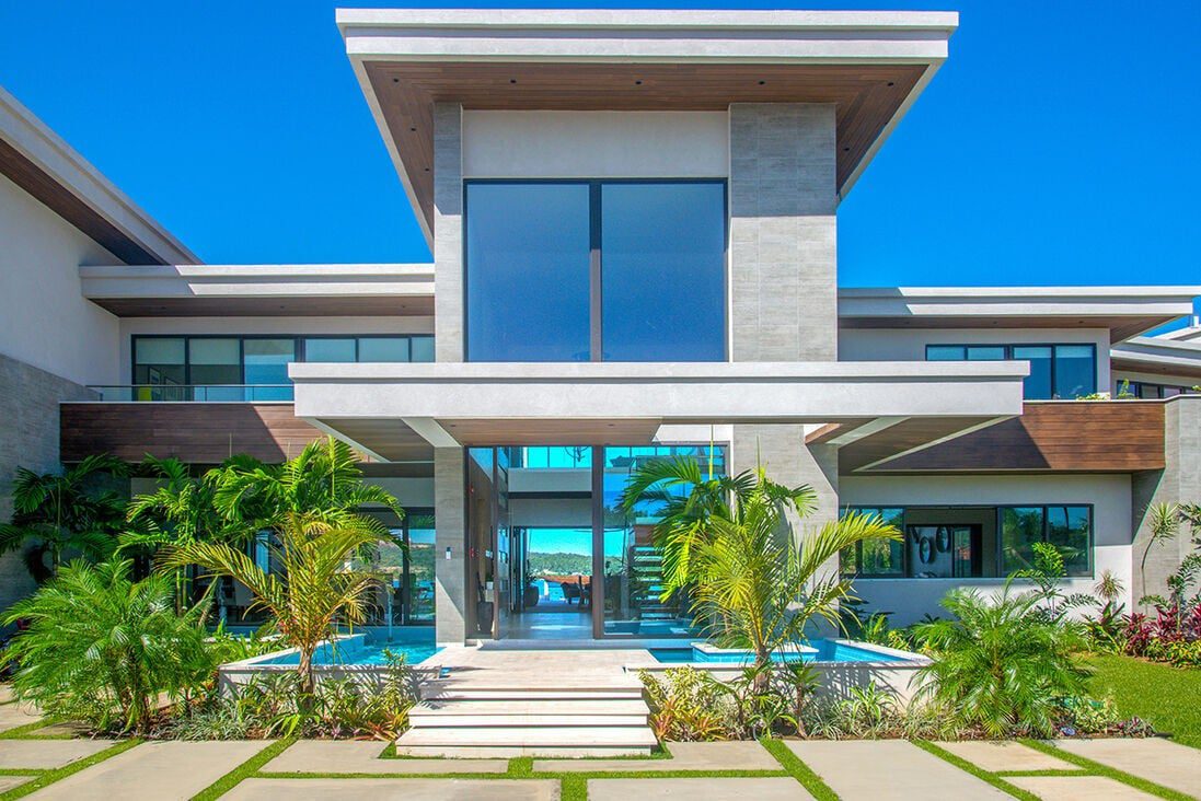 Modern Jamaican villa exterior with pool